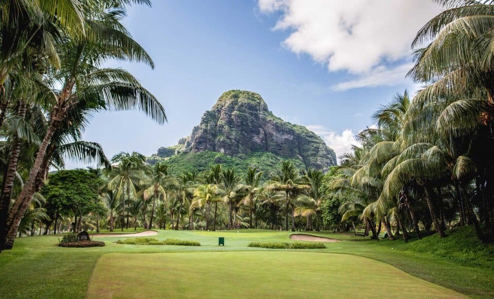 Golf green with Le Morne mountain backdrop at Paradis Golf Course, Mauritius