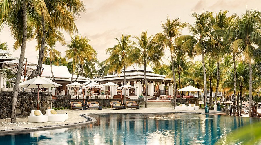 Paradis Beachcomber resort pool at sunset in Mauritius